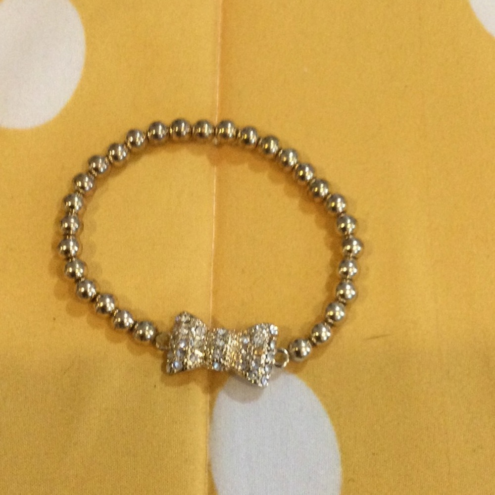 Stretch gold beaded bow bracelet